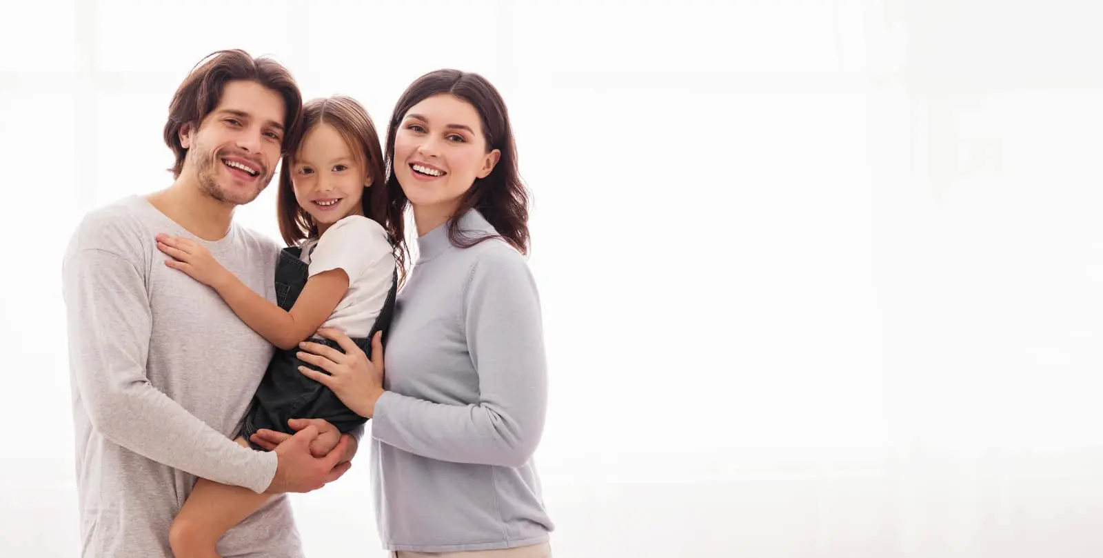 Family smiling after preventative dental care at Sierra Springs Dental